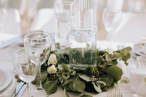 Decorations on the wedding table for a festive dinner in a restaurant Stock Photos