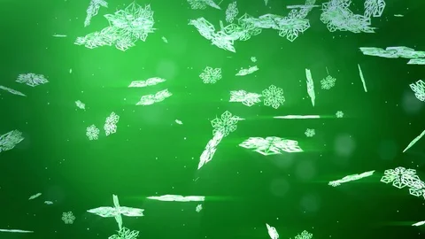 Decorative 3d snowflakes float in air in slow motion and shine on a green Stock Footage 82860712