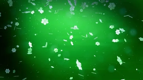 Decorative 3d snowflakes float in air in slow motion and glowing on a green Stock Footage 83375221