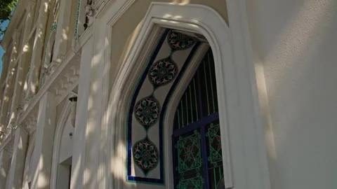Decorative Arched Entrance with Patterned Tile and Metal Gate Stock Footage 338243951