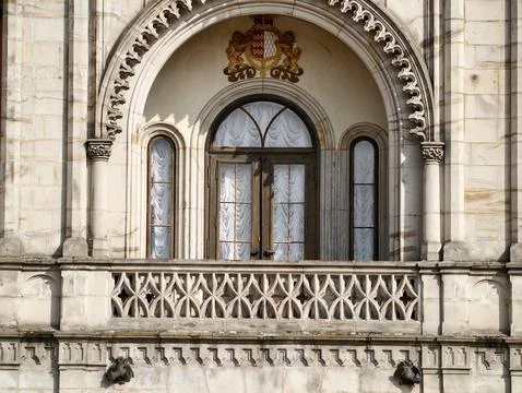 Decorative Arched Window Structure. Ornate Stone Balcony Featuring Arched W.. Stock Photos
