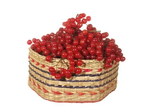 Decorative basket of hexagonal shape with red berries isolated on white backg Stock-Fotos