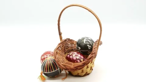 Decorative basket with painted Easter eggs on white background Stock Footage 108636432