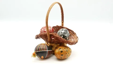 Decorative basket with painted Easter eggs on white background Stock Footage 108636509