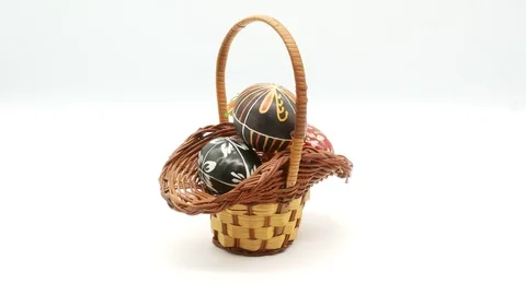 Decorative basket with painted Easter eggs on white background Stock Footage 108636620
