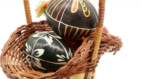 Decorative basket with painted Easter eggs on white background Stock Footage 108636831