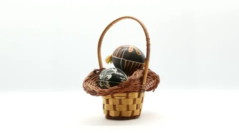 Decorative basket with painted Easter eggs on white background Stock Footage 108636969