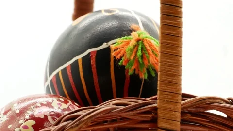 Decorative basket with painted Easter eggs on white background Stock Footage 108637338