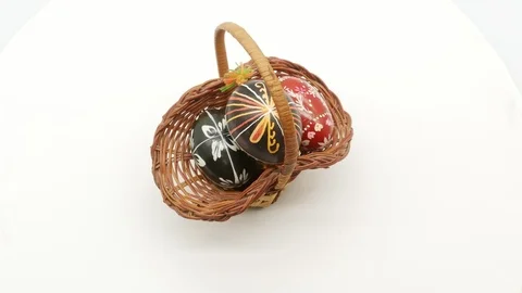 Decorative basket with painted Easter eggs on white background Stock Footage 108637613