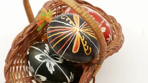 Decorative basket with painted Easter eggs on white background Stock Footage 108637788