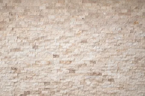 Decorative beige brick wall background Stock Photos
