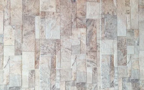 Decorative Beige Stone Wall Texture with Rectangular Tile Pattern Stock Photos