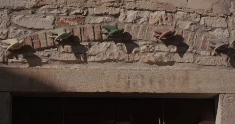 Decorative bird figures on stone wall above doorway Video stock 334032996