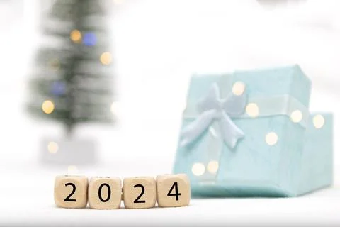 Decorative blue gift box on white background with bokeh of lights Stock Photos