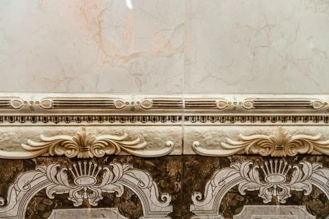 A decorative border on a wall, with a design that includes a lot of detail Stock Photos