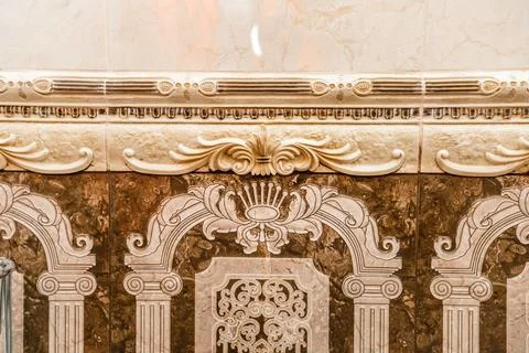 A decorative border on a wall, with a design that includes a lot of detail Stock Photos