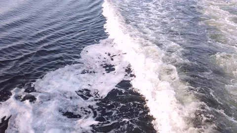 Decorative bow waves of an excursion boat at sunset Stock Footage 140656849