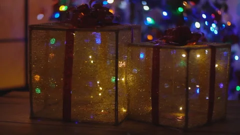 Decorative boxes on the background of the Christmas tree Stock Footage 103860059