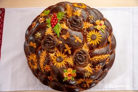 Decorative bread with floral designs displayed at a cultural event 스톡 사진