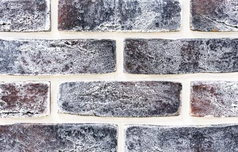 Decorative brick wall from of brown bricks. Background and texture of brickwork. Stock Photos