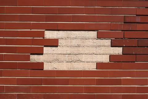Decorative brick wall with empty patch Foto stock
