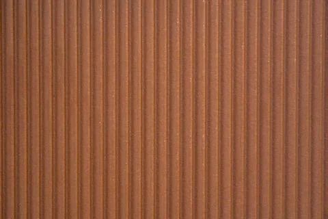 Decorative brown ceramic wall tile with vertical grooves Stock Photos