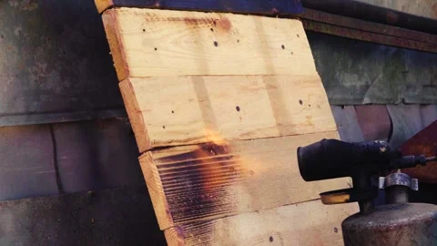 Decorative burning of a wooden pallet Stock Footage 331942953