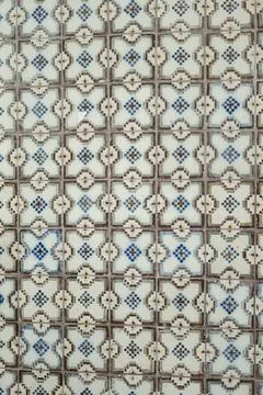 The decorative ceiling has blue, white and grey tile design Stock Photos