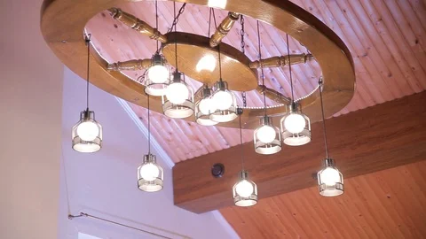 Decorative ceiling stylish lamp. Oval wooden chandelier. Stock Footage 129492374