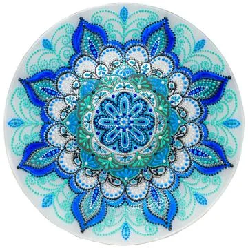 Decorative ceramic dish painted with a circular pattern, isolated on a white  Stock Photos