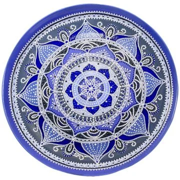 Decorative ceramic dish painted with a circular pattern, isolated on a white  Stock Photos