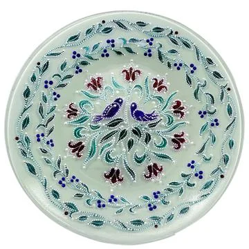 Decorative ceramic dish painted with a circular pattern, isolated on a white  Foto stock