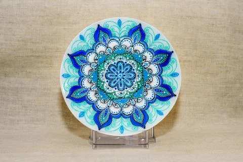 Decorative ceramic dish painted with hands. Art, handmade. Stock Photos