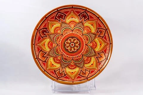 Decorative ceramic dish painted with hands. Art, handmade. Stock Photos