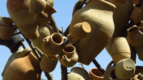 Decorative Ceramic Jars Hanging From Tree Stock Photos