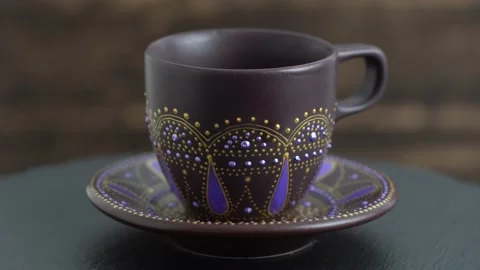 Decorative ceramic painted cup and saucer rotates, close up Stock Footage 140755478