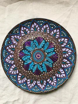 Decorative ceramic plate with  different colors. painted plate on white backg Stock Photos