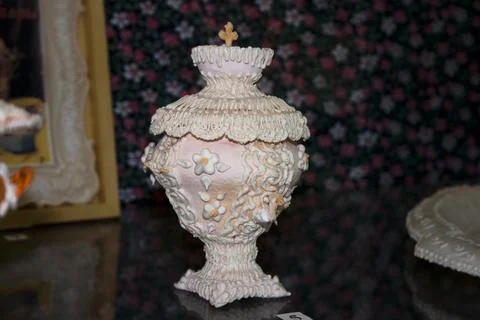 Decorative ceramic vase in the interior of the room. Selective focus. Stock Photos