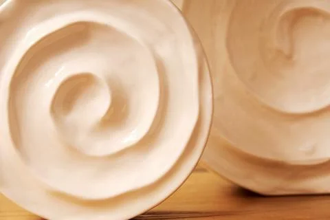 Decorative ceramic vases of a round shape on the table Stock Photos