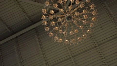 Decorative chandelier on an industrial ceiling Stock Footage 337910792