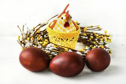 Decorative chicken with Easter eggs on a white isolated background Stock Photos