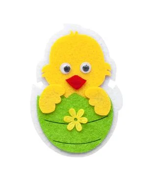 Decorative chicken hatched from a green Easter egg made of felt Stock Photos