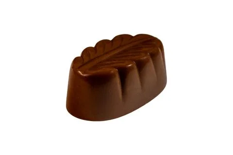 Decorative chocolate praline with embossed leaf pattern and glossy surface Foto stock