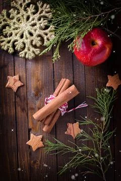 Decorative christmas composition - cinnamon, apple, spruce, snowflake, star.. Stock Photos