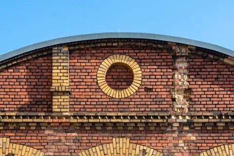 Decorative circle in old brick facade made by red and beige clinker Stock Photos