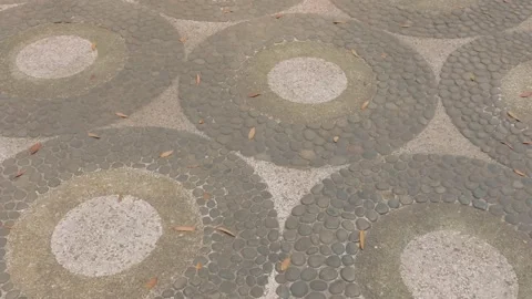 Decorative circular stone pattern on outdoor pavement surface. Video stock 343367456