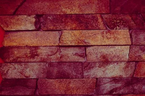 Decorative cladding with colored ceramic bricks of the facade of the building Stock Photos