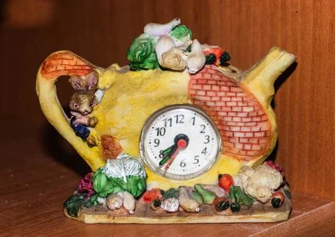 Decorative clock with ceramic figures,table clock in the form of a ceramic .. Stock Photos