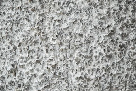 Decorative coating with fine stone abrasive, light background Stockfoto's