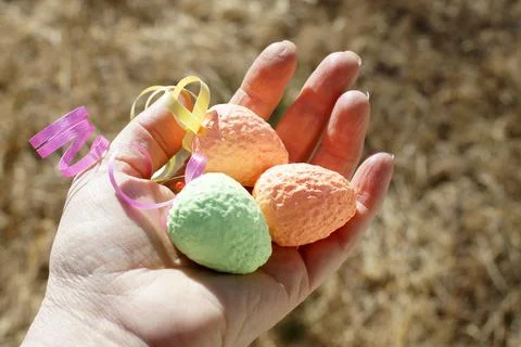 Decorative colorful eggs in hand, Easter Stock Photos